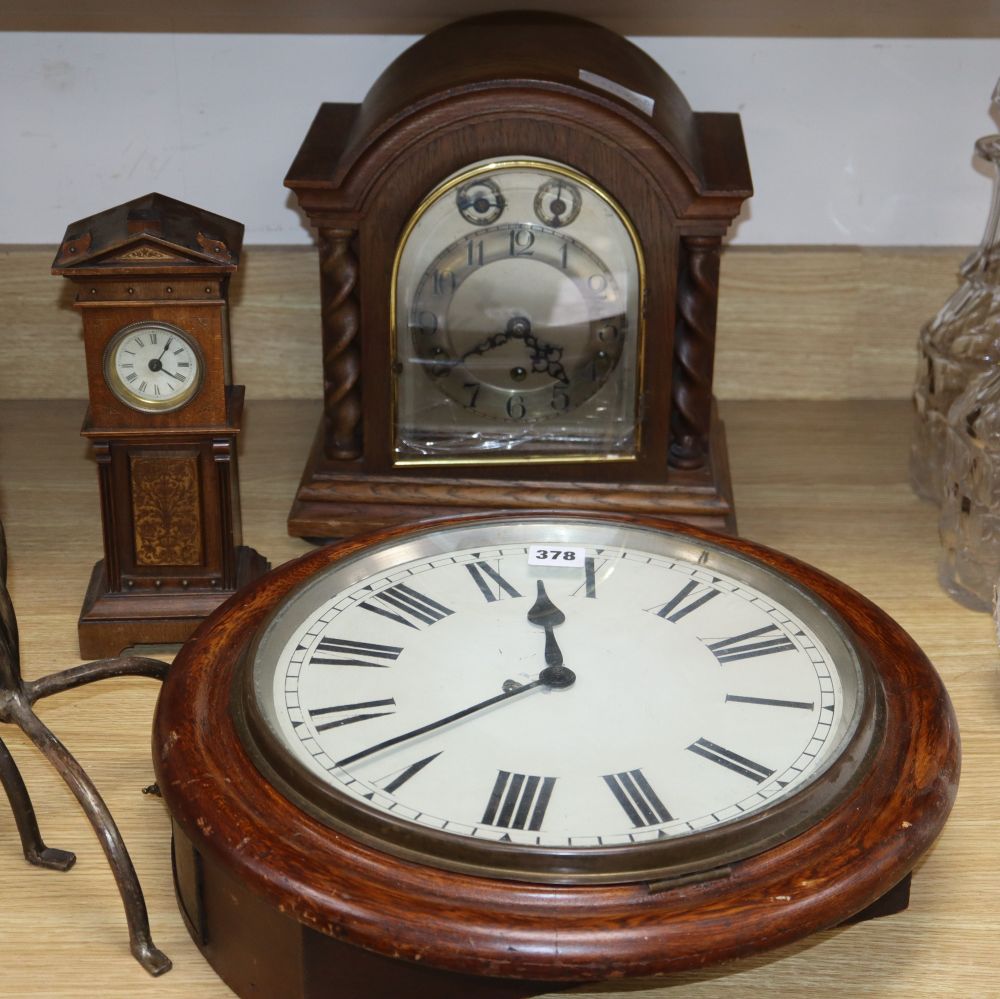 A miniature longcase clock, a wall clock and an oak mantel clock